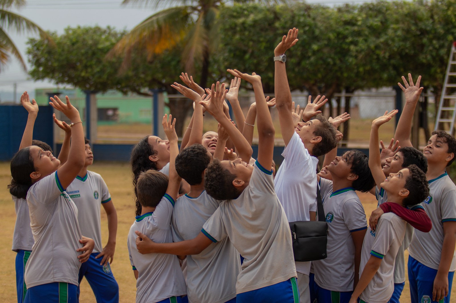 In a schoolyard, young voices echo a global call: “Nothing about us, without us.” Image: Carlos Ferraz / Instituto Agir
